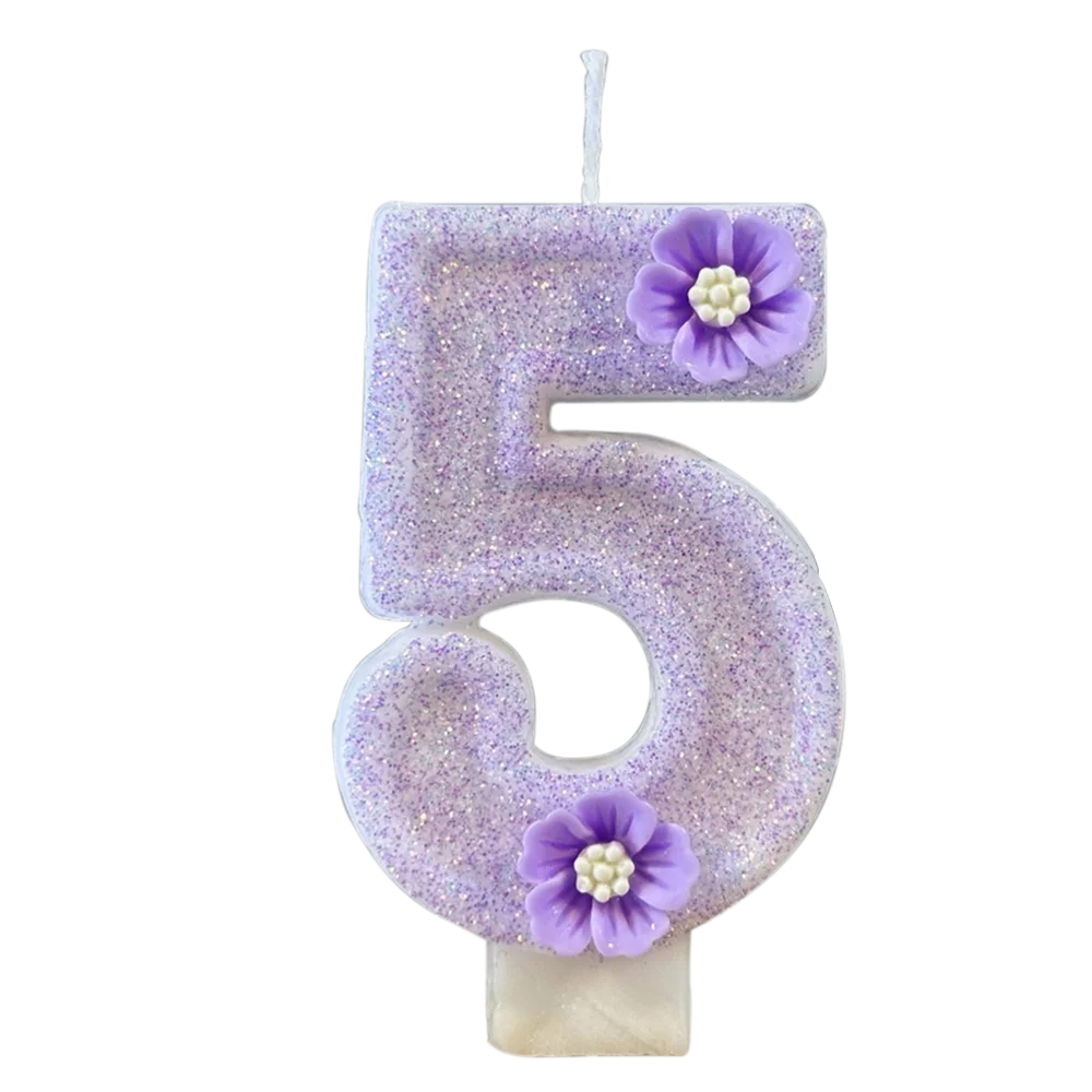 A purple sparkling number five candle decorated with small purple flowers.