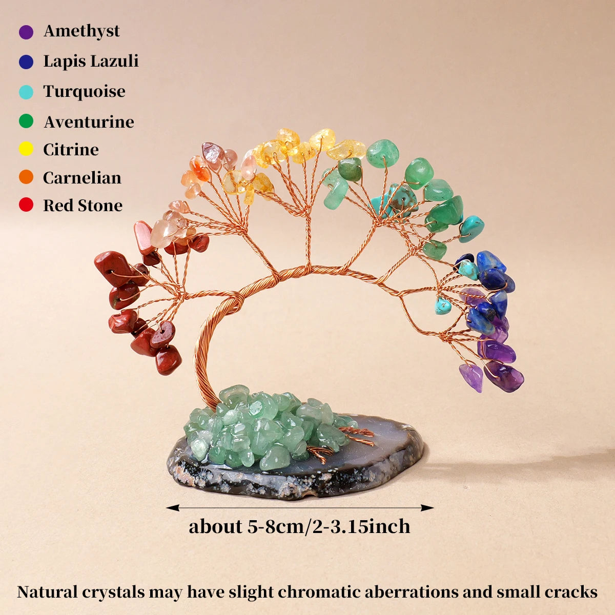 A crystal tree made of various colored crystals mounted on an agate base for home decor