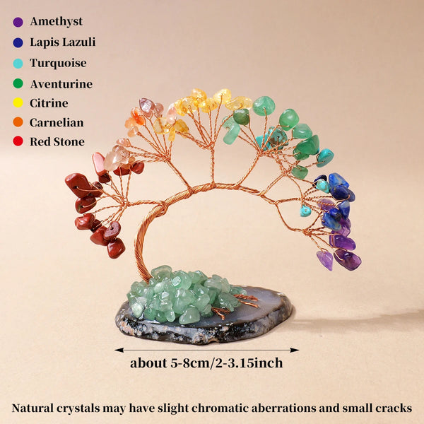 A crystal tree made of various colored crystals mounted on an agate base for home decor