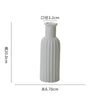 White ceramic desktop vase with an organic ripple design, measuring 6.70cm long and 20.0cm high.
