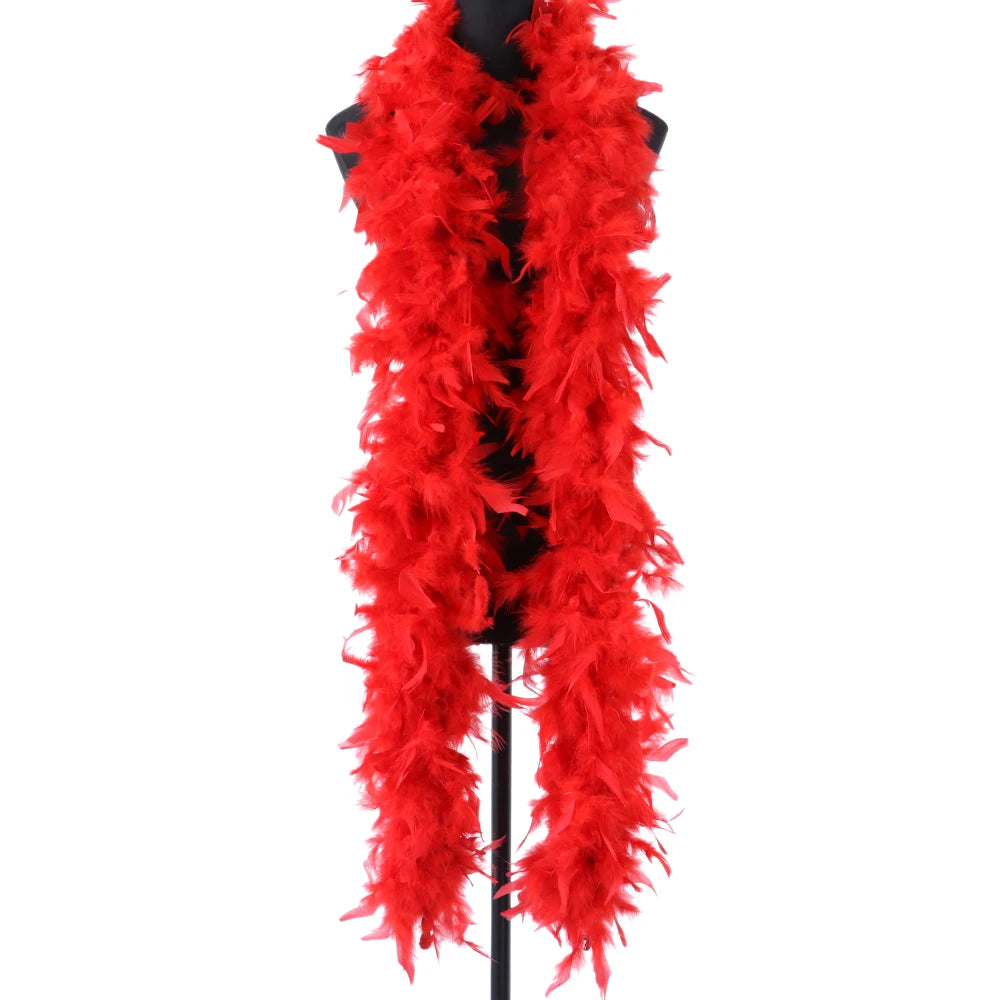 A bright red natural turkey feather boa displayed on a black hanger.