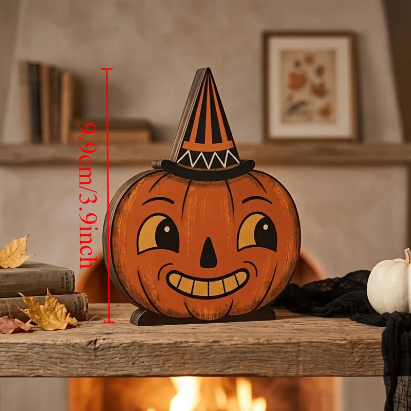 A carved wooden pumpkin decoration with a pointed hat, displayed on a wooden surface.