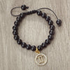 Handmade zodiac beaded bracelet with natural black stone and a gold zodiac charm