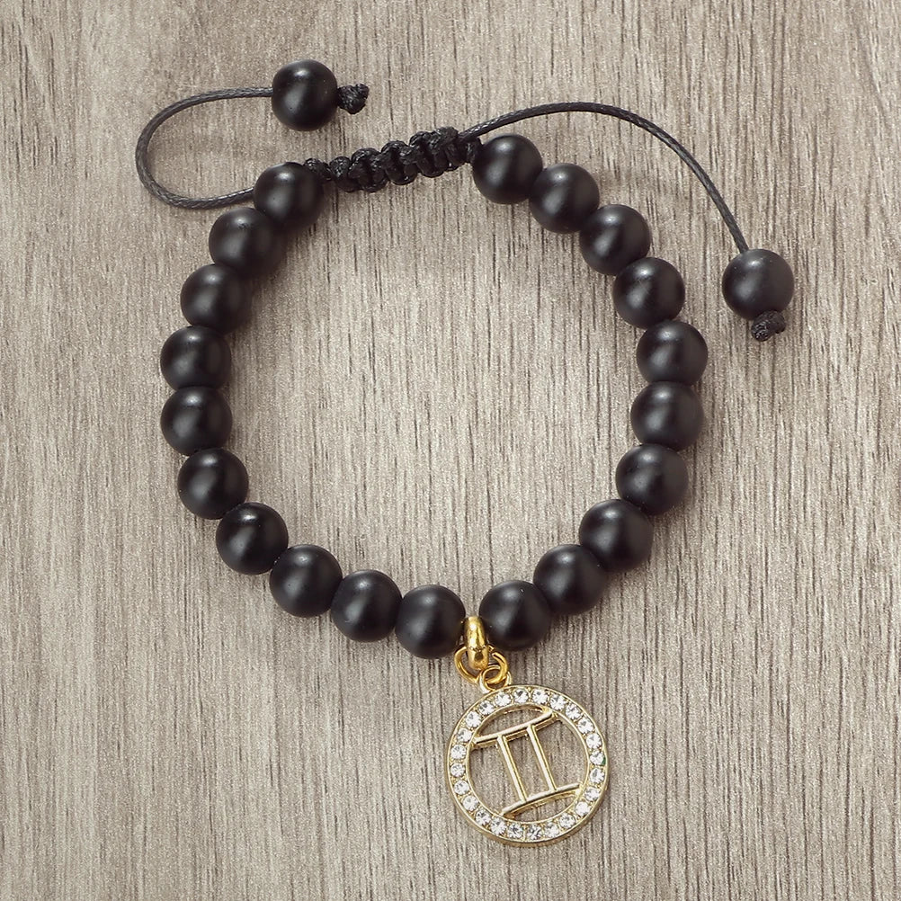 Handmade zodiac beaded bracelet with natural black stone and a gold zodiac charm
