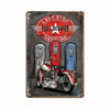 Vintage metal tin sign featuring a motorcycle and text advertising last stop full service gasoline.