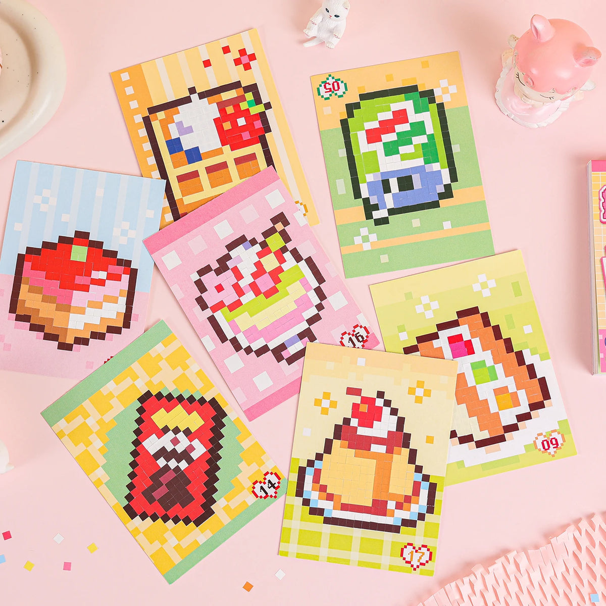 A collection of colorful, handmade cartoon mini bean die cut stickers on a pink background.