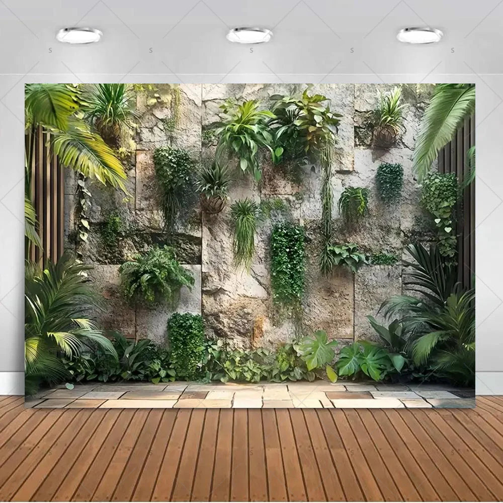 A vertical wall backdrop featuring lush green tropical plants and palm leaves for party decor or photography.