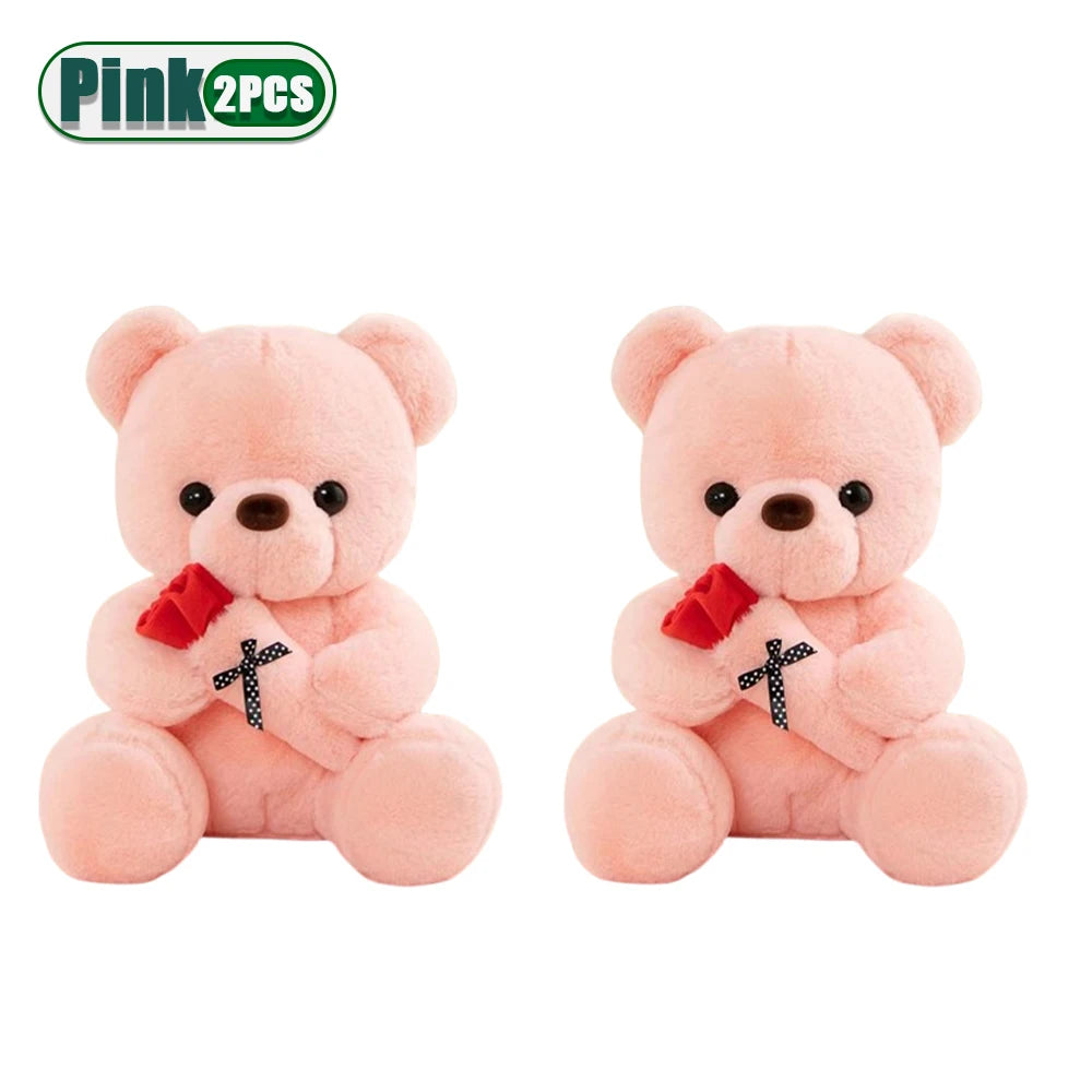 A pair of pink teddy bear plush toys with faux flowers.