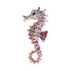 A vintage marine life brooch pin set featuring a silver-toned fish design encrusted with colorful rhinestones.