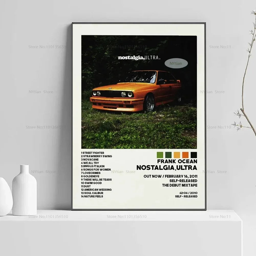 A framed photograph of an orange car in a grassy field with the text nostalgia ultra and Frank Ocean nostalgia ultra