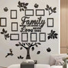 A wall collage featuring a family tree design made of dark wood-toned stickers on a white wall.