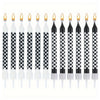 A row of twelve black and white checkered birthday cake candles with gold star toppers.