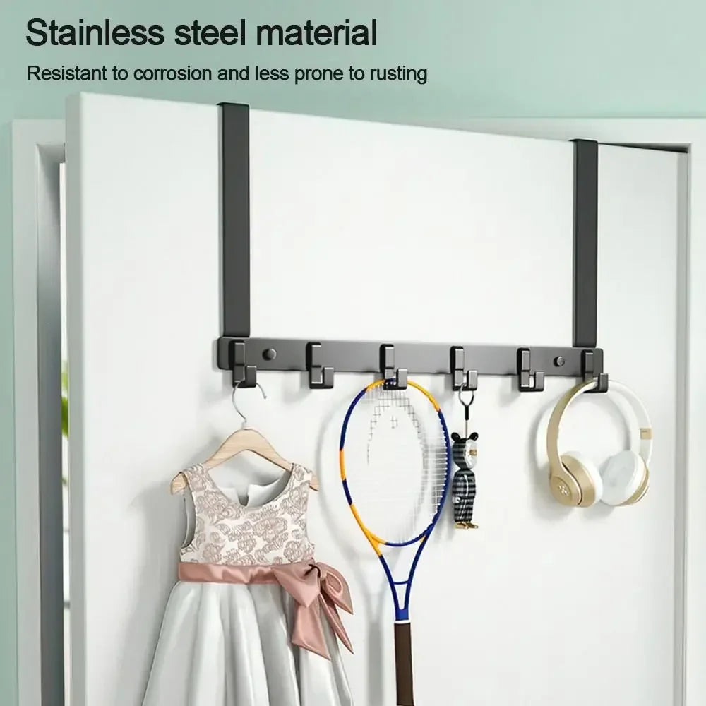 Stainless steel door hooks with a tennis racket, headphones, and a hanger displayed on a white door.