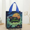 A dark blue gift tote bag featuring a Halloween print with pumpkins and bats against a green background.