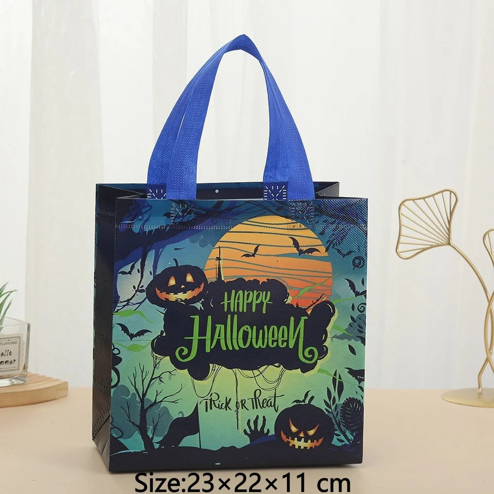 A dark blue gift tote bag featuring a Halloween print with pumpkins and bats against a green background.