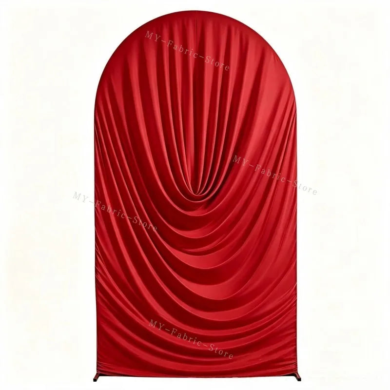 A vibrant red draped fabric arch cover used for weddings and events.