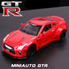 A red MiniAuto GTR diecast sports car model displayed on a dark surface.