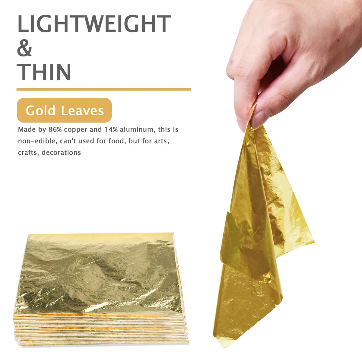 A hand holds a sheet of imitation gold leaf, showing its thin, metallic texture.