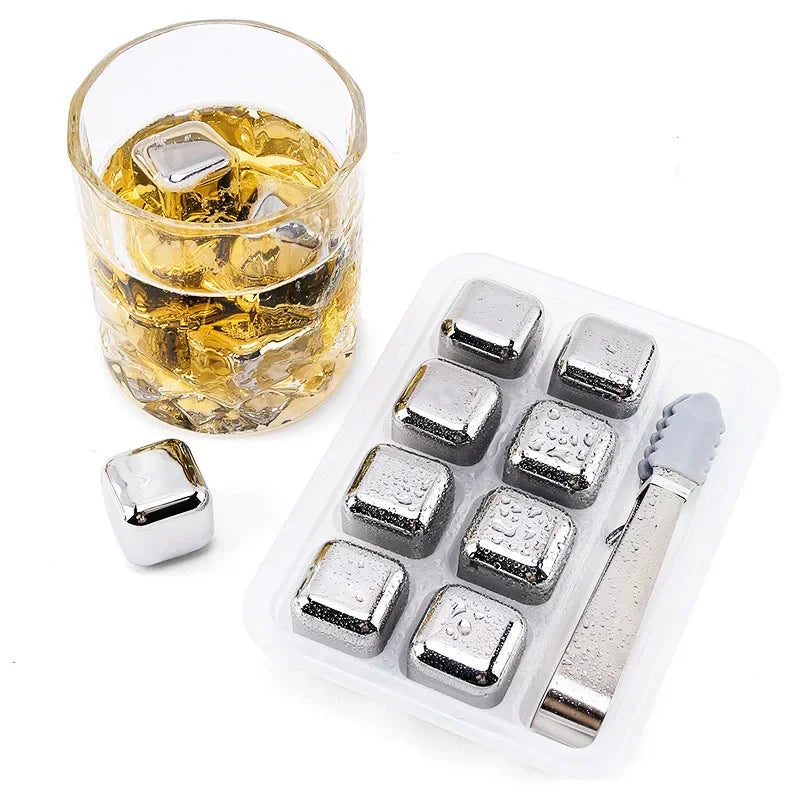 Reusable stainless steel ice cubes in a glass and a storage tray