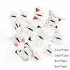A collection of 12 paper or vinyl butterfly wall stickers in various sizes and patterns
