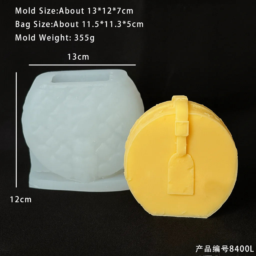 A white silicone mold and a yellow silicone candle mold are shown next to each other.