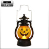 A black lantern shaped like a carved jack-o'-lantern with an orange glow and a spooky face design.