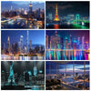 A collage of nighttime city skylines featuring various high-rise buildings and bridges.