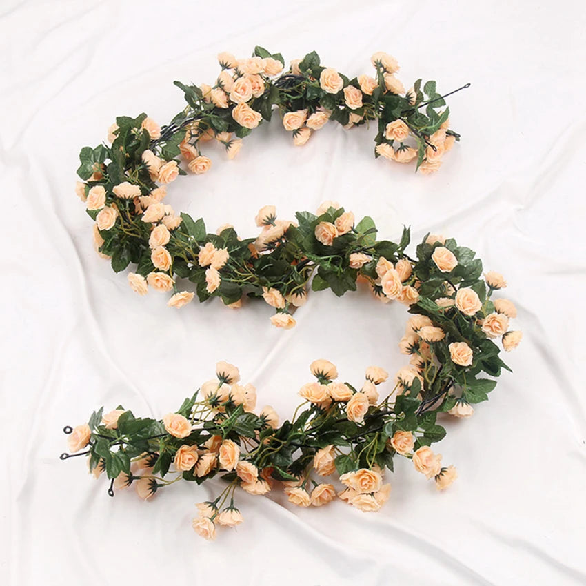 A green silk rose vine garland used for wedding and home decor