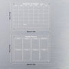 A set of magnetic acrylic dry erase fridge planners showing monthly and weekly layouts.
