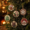 Christmas diamond painting ornaments featuring Santa, a snowman, and reindeer pendants hanging on a green fir tree.