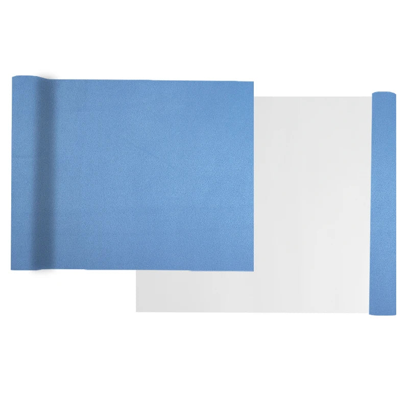 A sheet of blue suede wrap fabric is shown next to a white sheet, demonstrating the material for DIY projects.