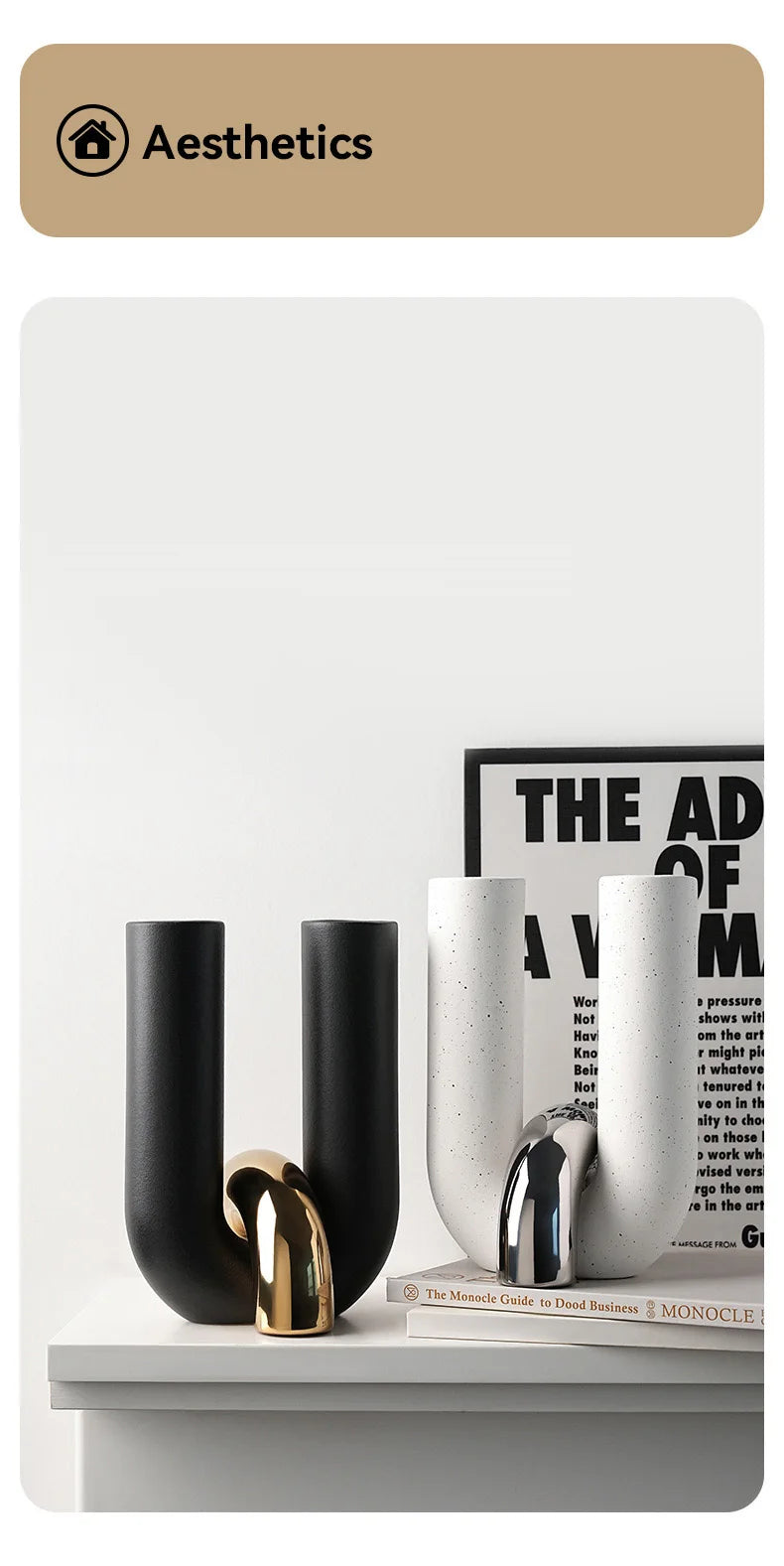 A collection of black and white ceramic U-shaped tabletop vases displayed on a white surface.