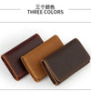 Three colors of vintage leather card holders displayed together.