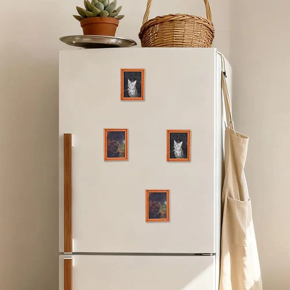 A white fridge magnet display featuring framed pictures of cats on a refrigerator.