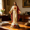 A religious figurine set depicting Jesus and the Blessed Mother, dressed in white and red robes.
