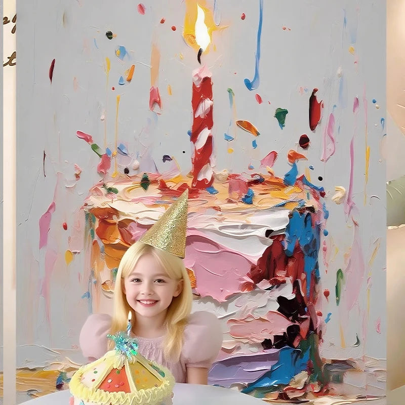 A young girl smiles in front of a colorful, abstract painting backdrop featuring a large candle and cake elements.