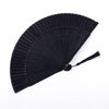 Black traditional Chinese folding fan with pleated paper blades.