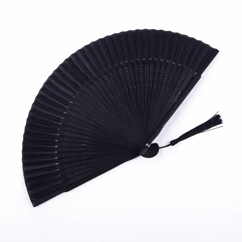 Black traditional Chinese folding fan with pleated paper blades.