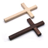 Handcrafted wooden wall cross with a two-tone finish, featuring light and dark wood tones.