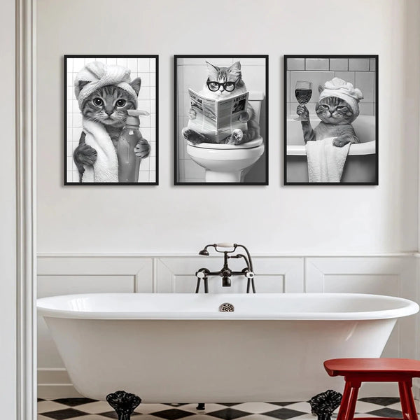 A set of three canvas art prints featuring cats in various poses and settings for home decor