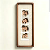 A vertical photo strip frame with a walnut wood border displaying six portrait photos of a couple.