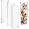A set of four clear acrylic photo frames, including a vertical frame and three horizontal frames featuring different photos.