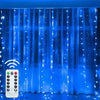 Blue fairy curtain string lights illuminating a window or backdrop.