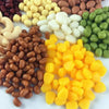 A collection of various colored resin fake corn miniatures for crafting and décor
