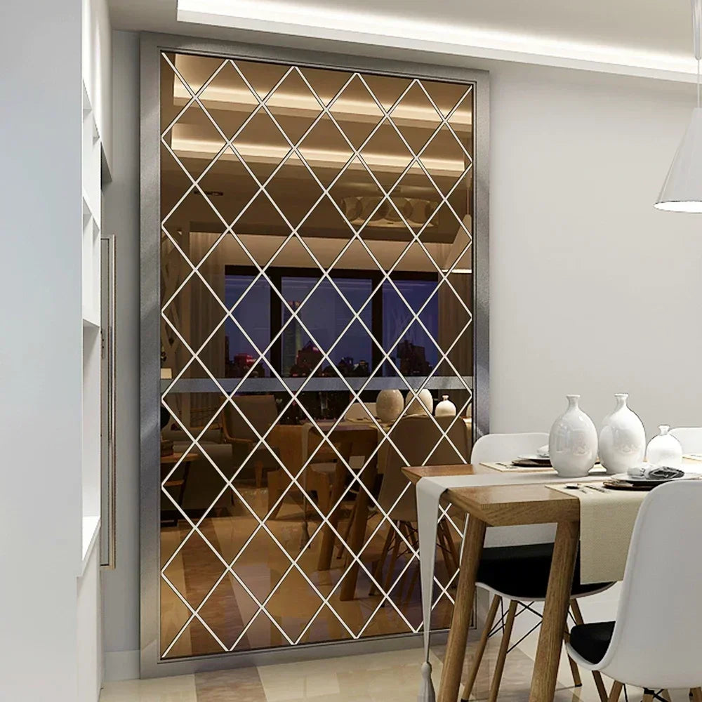 A rectangular diamond-patterned mirror with a silver frame reflecting an interior room.