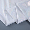 Folded silver sequin backdrop curtain fabric showing glitter texture and drape