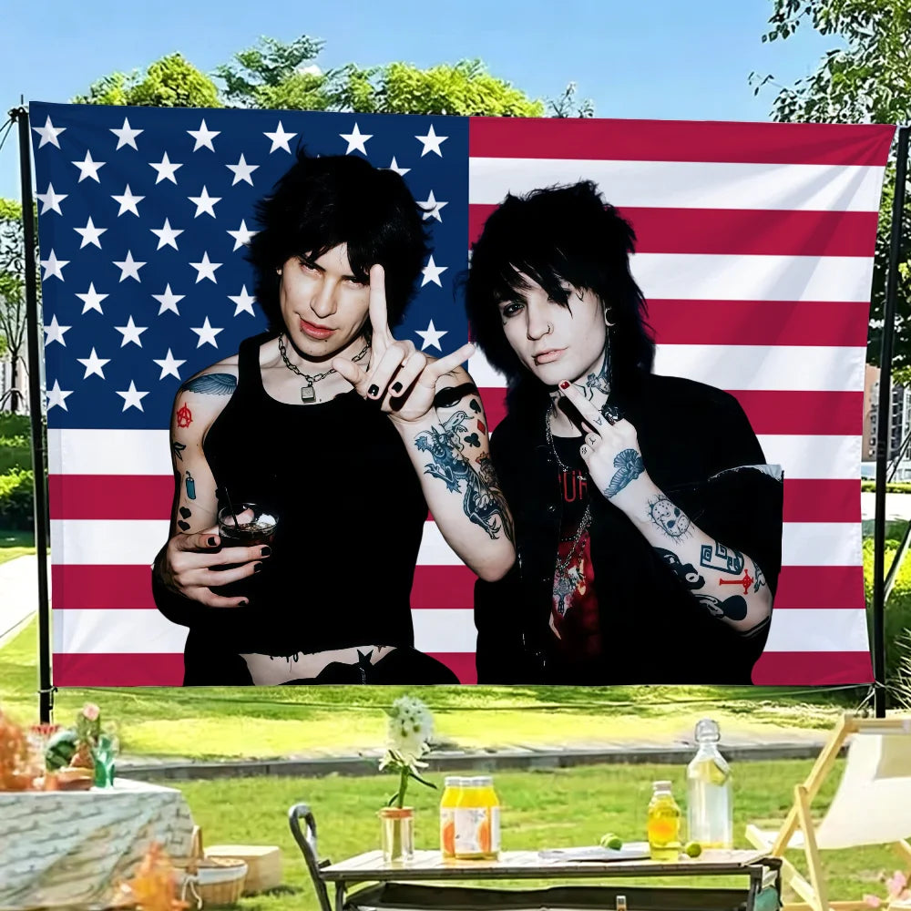 A photo of Jake Webber and Johnnie Guilbert against an American flag backdrop.