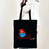 Black tote bag featuring a red Santa hat and holiday design with glitter accents