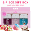 A pink gift box containing three Wish hand sanitizer sprays in fruit punch, cotton candy, and island coconut scents.