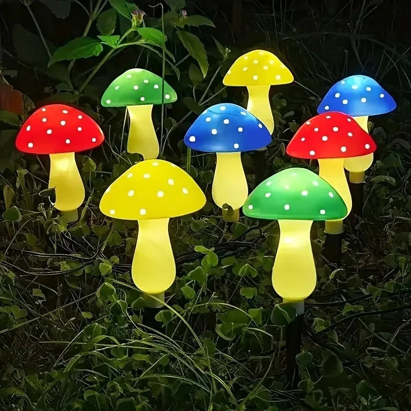 Six illuminated solar mushroom garden lights in various colors including red, green, yellow, and blue.